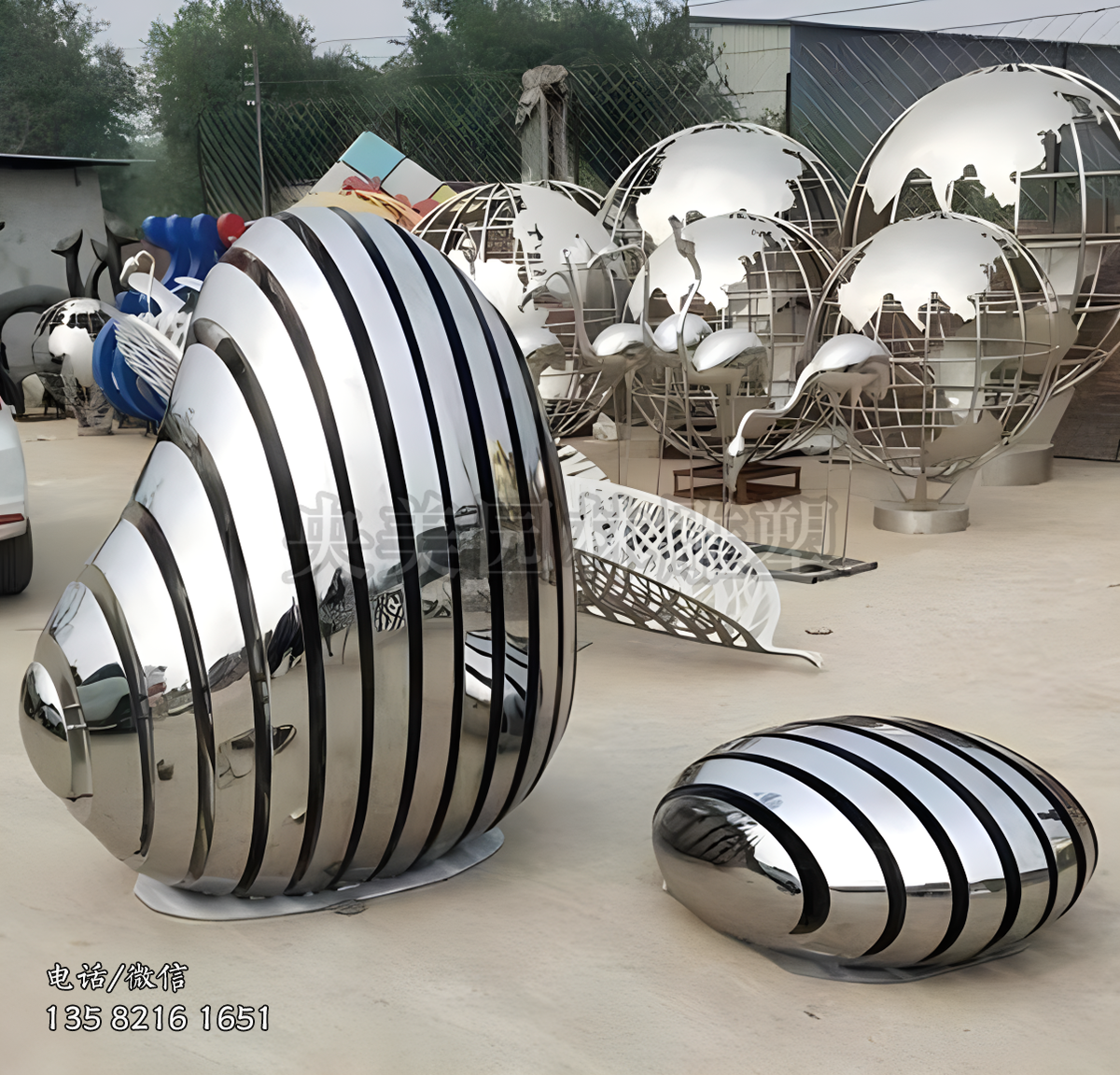 鏡面不銹鋼截面拼接鵝卵石造型雕塑